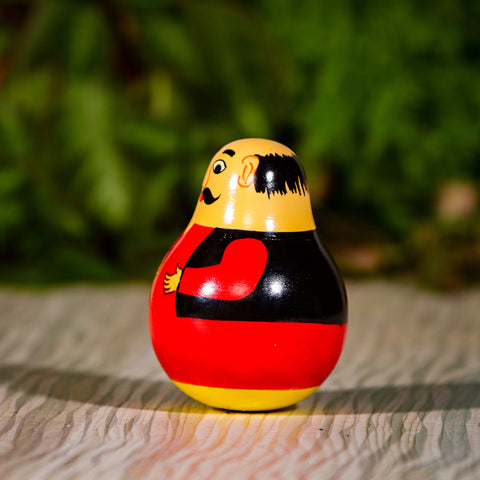 men balancing doll