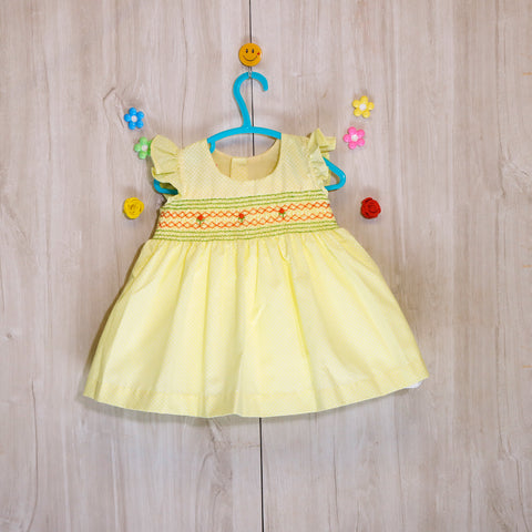 smocked baby frocks yellow color