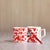ceramic white mugs with red dots