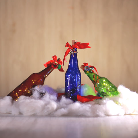 decorative christmas bottles with string light