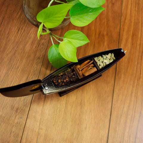 wooden chundan vallam with kerala spices